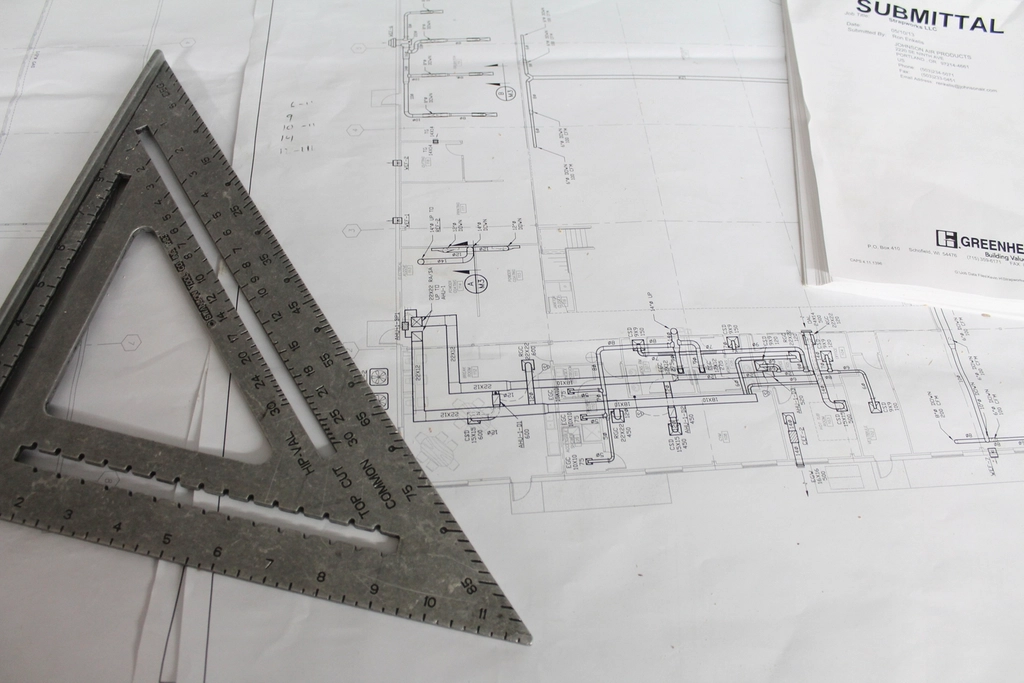Construction team using management software to coordinate a project on site